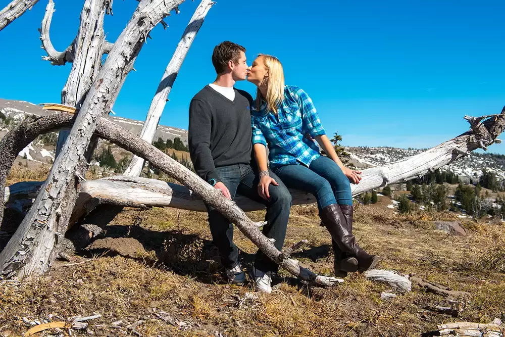 mountain engagement photos a couple kisses sitting on a log Unforgettable Moment - Mountain Engagement Photos 
with
​ Photojournalist Photographer Robert Knapp