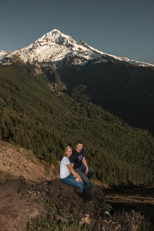 mountain engagement photos A couple sits on a rock in front of a massive snow capped mountain Unforgettable Moment - Mountain Engagement Photos 
with
​ Photojournalist Photographer Robert Knapp