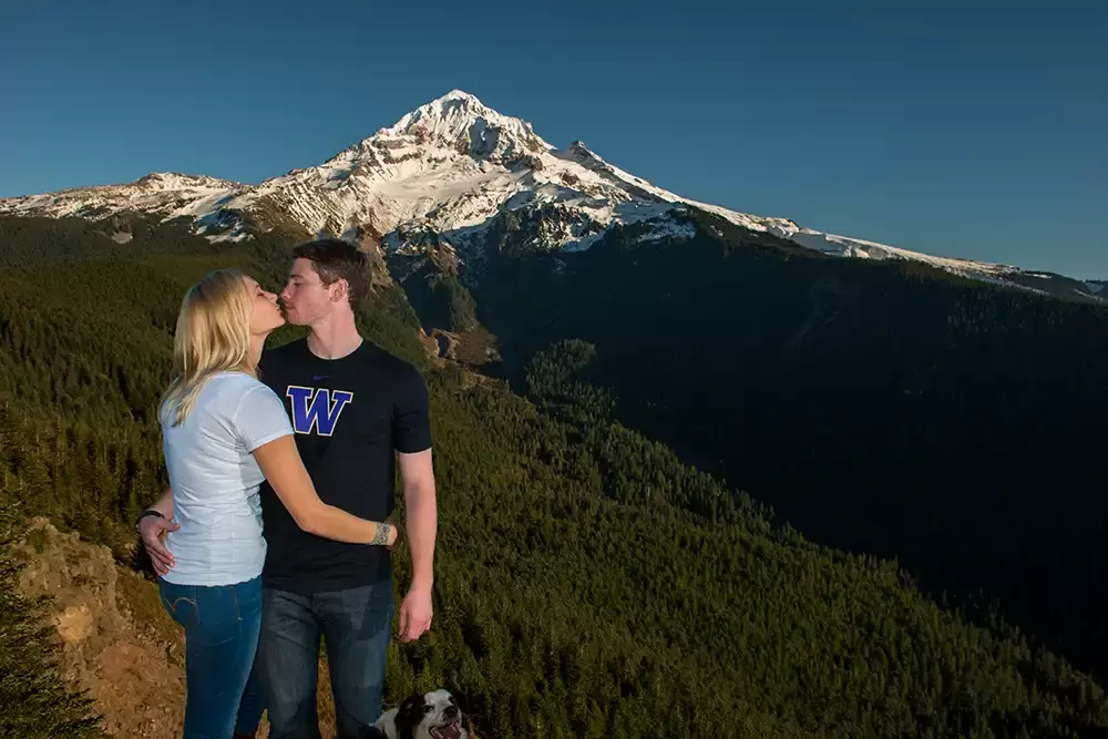 mountain engagement photos, a couple kiss on the edge of a cliff Unforgettable Moment - Mountain Engagement Photos 
with
​ Photojournalist Photographer Robert Knapp