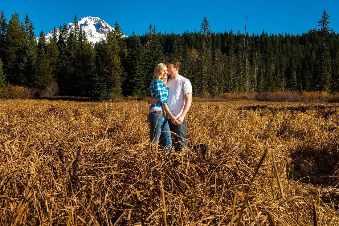 mountain engagement photos of a man and woman kissing in a mountain meadow in the autumn light. Unforgettable Moment - Mountain Engagement Photos  with ​ Photojournalist Photographer Robert Knapp