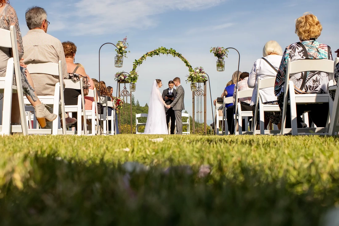 ​Vineyard Wedding Oregon where a couple stands in front of the guests during the ceremony