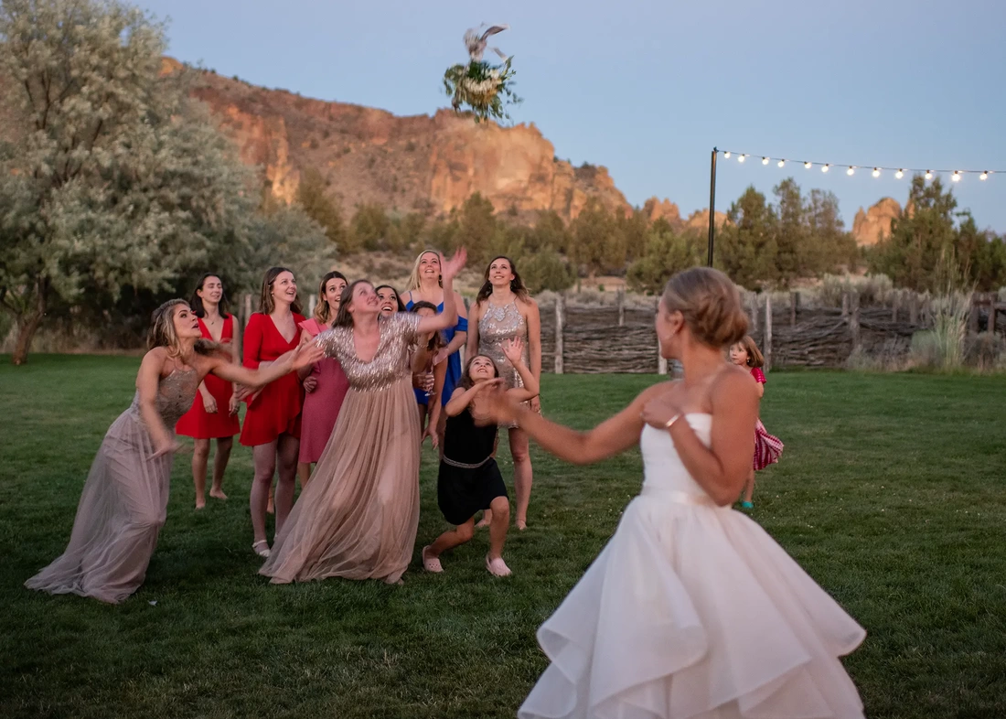 Wedding Photographers in Bend Oregon  Modern Art Photograph's photography from a Ranch at the Canyons Wedding the bouquet is in the air Wedding Photographers in Bend Oregon  Modern Art Photograph's photography from a  ​Ranch at the Canyons Wedding