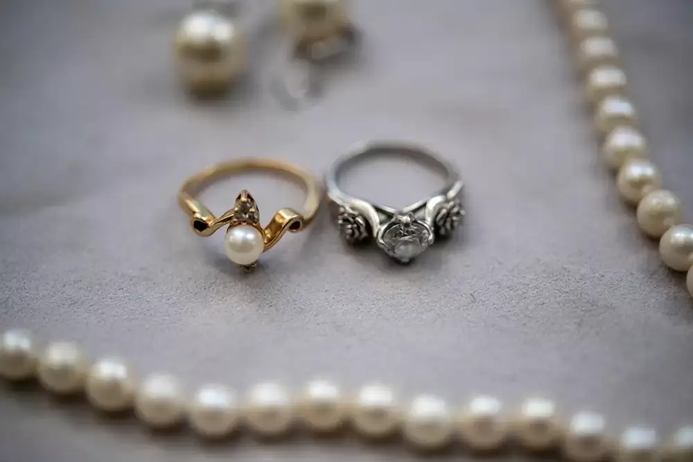 Wedding Photographers Near Me | Modern Art Photograph
Wedding Photography
from Oceanside, Oregon bride has rings resting on a table with some jewelry 
