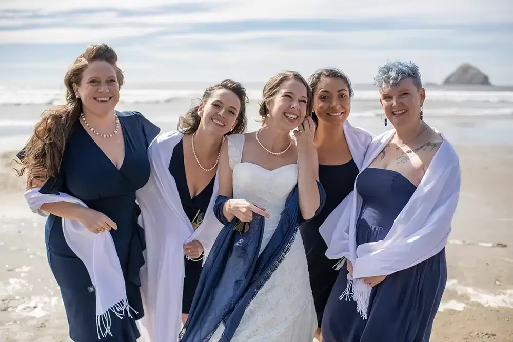 Wedding Photographers Near Me | Modern Art Photograph
Wedding Photography
from Oceanside, Oregon bride and bridesmaids stand on the sand with the ocean in the background.