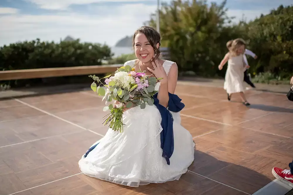 bride kneels Wedding Photographers Near Me