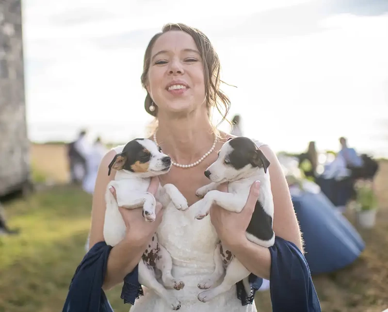 bride holding puppies Wedding Photographers Near Me