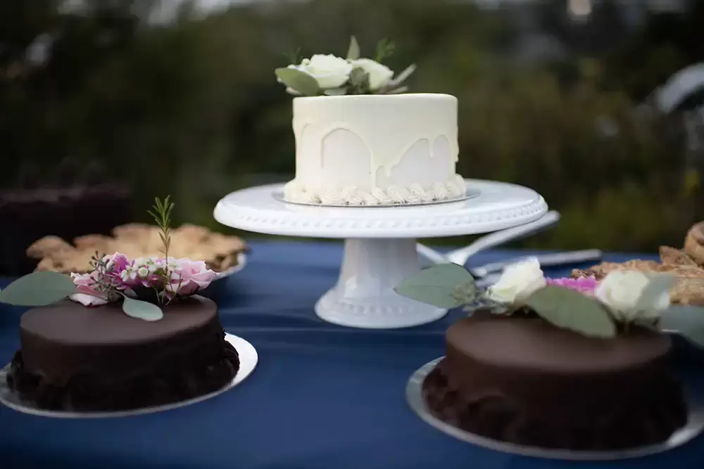 Wedding cakes sit on the desert table Wedding Photographers Near Me