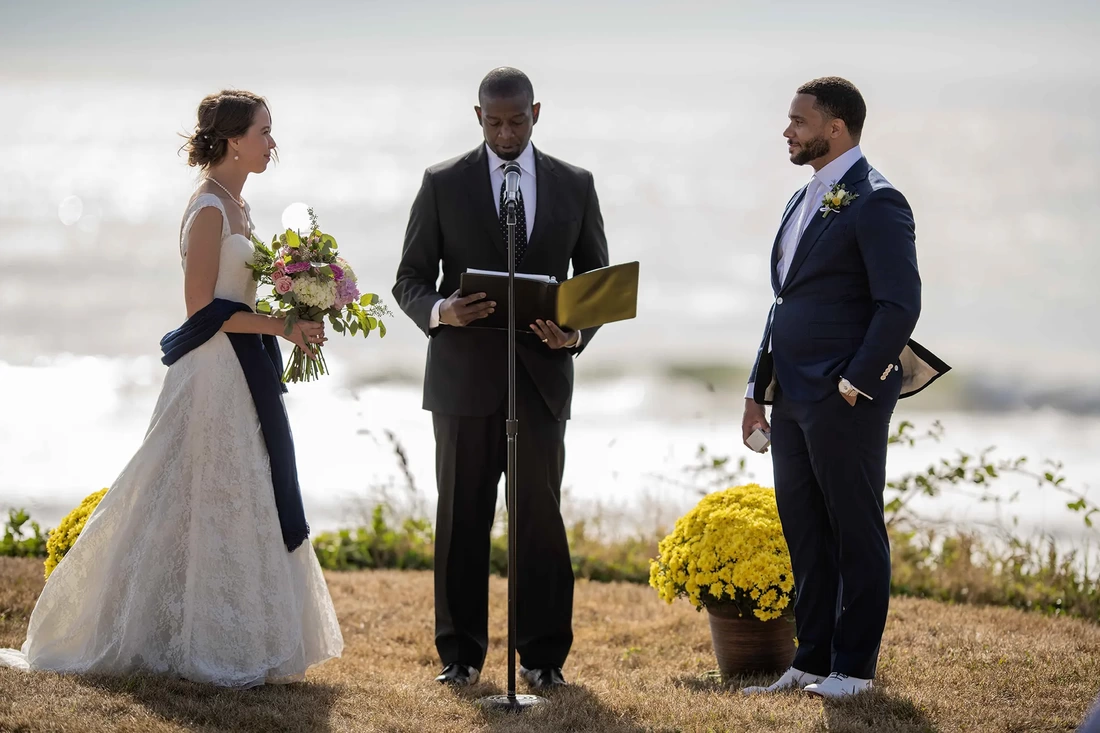 Wedding Photographers Near Me | Modern Art Photograph Wedding Photography from Oceanside, Oregon bride and groom stand with a judge for a wedding on the beach Wedding Photography from Oceanside, Oregon Wedding Photographers Near Me | Modern Art Photograph