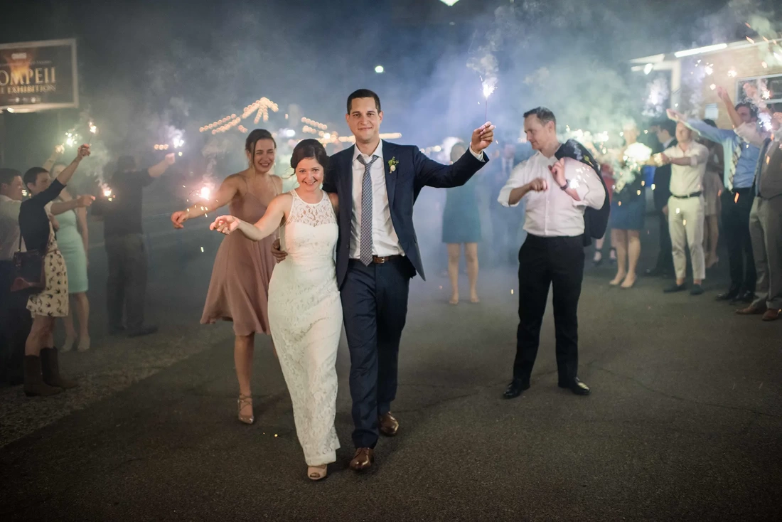 Opal 28 ​Wedding Photography from Robert Knapp Photographer bride and groom hold sparklers together at the formal send off. Wedding Photography from Opal 28 Robert Knapp photographer at Opal28 