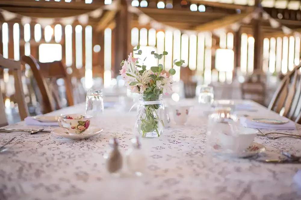 Tin Roof Weddings Barn Weddings Venues Near Me from Photographer Robert Knapp A close-up of a table setting for the reception