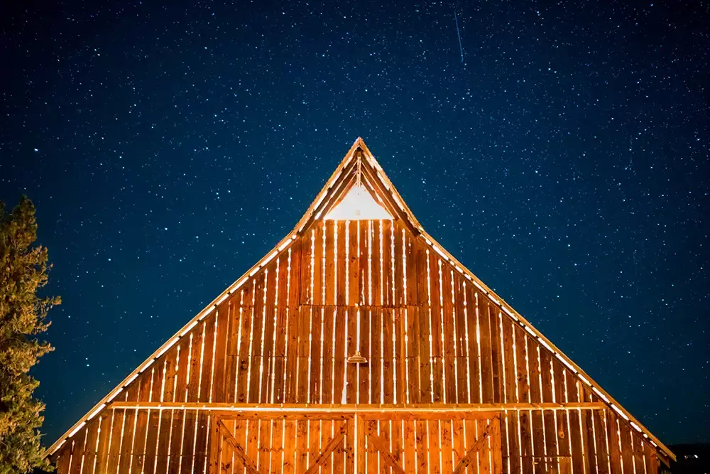 Tin Roof Weddings Barn Weddings Venues Near Me from Photographer Robert Knapp a Long Exposure of the bar stars are overhead there's a shooting star