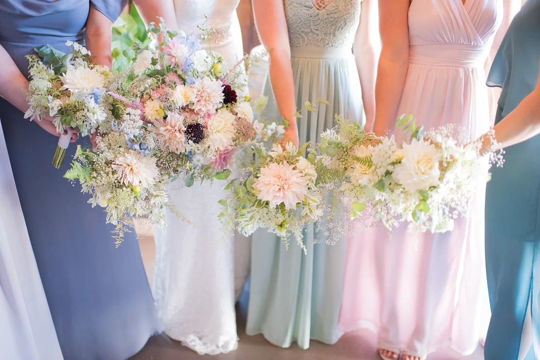 Tin Roof Weddings Barn Weddings Venues Near Me from Photographer Robert Knapp all the girls put their flowers together to make one massive bouquet, the background of the image is all the dress and ams of the bridesmaids. Tin Roof Weddings Barn Weddings Venues Near Me